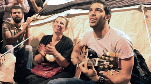 Egyptian activist Ramy Essam (R) in Jehane Noujaim’s documentary the Square. Courtesy of Noujaim Films