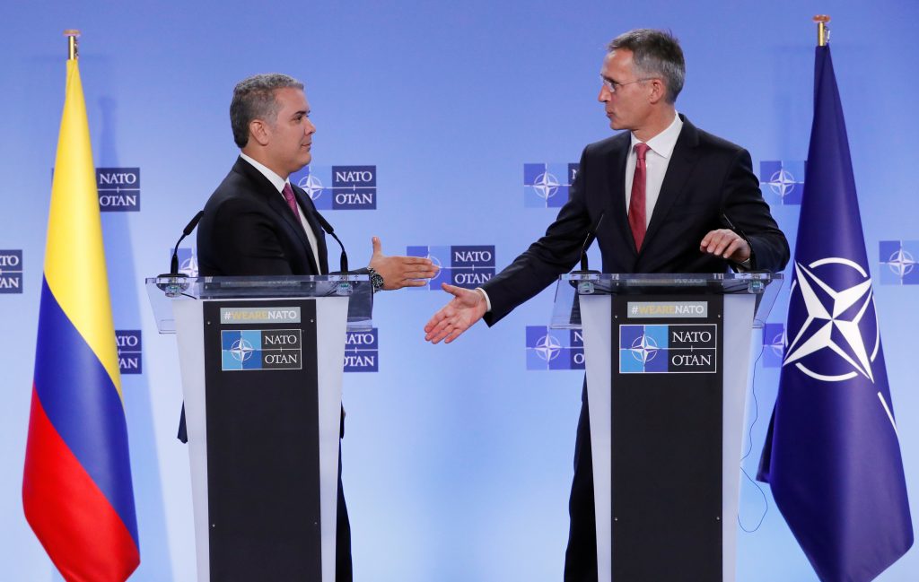 Colombian President Iván Duque shakes hands with NATO Secretary General Jens Stoltenberg after a meeting at the Alliance headquarters in Brussels, Belgium in 2018. Colombia is the first NATO global partner in Latin America. (REUTERS/Yves Herman)