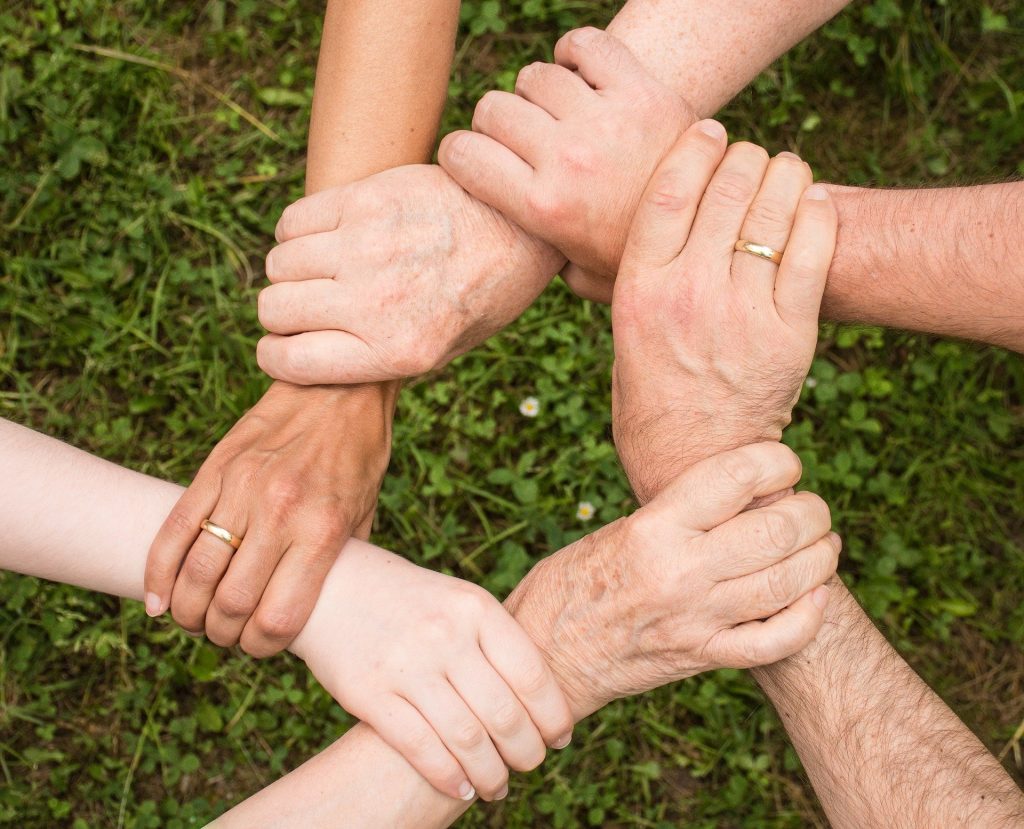 gtc holding hands together in team spirit and partnership