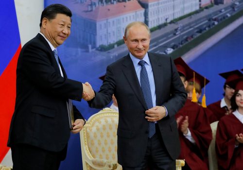 Chinese President Xi Jinping and Russian President Vladimir Putin shake hands during a ceremony at which Xi received an honorary degree from St. Petersburg State University, in St. Petersburg, Russia, June 6, 2019.